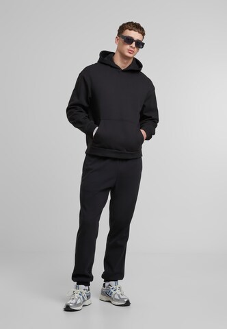 Tapered Pantaloni di SOUTHPOLE in nero