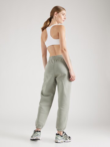 UNDER ARMOUR Tapered Sportbroek 'Essential' in Groen