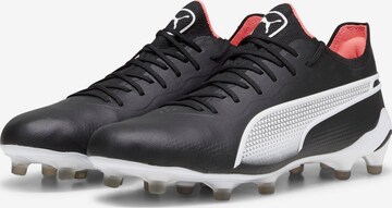 Ghete de fotbal 'King Ultimate' de la PUMA pe negru