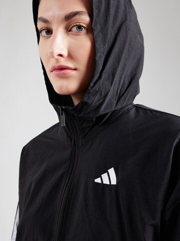 ADIDAS SPORTSWEAR - Chaqueta deportiva en negro