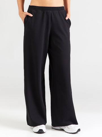 UNDER ARMOUR - Pierna ancha Pantalón deportivo 'Motion' en negro: frente