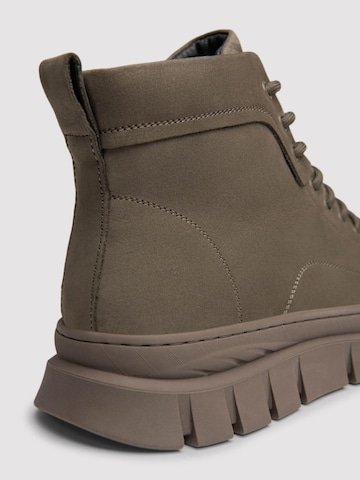 Ombre - Botas con cordones en verde