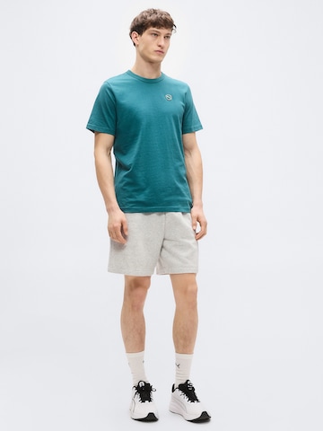Tricou 'ESS' de la PUMA pe verde