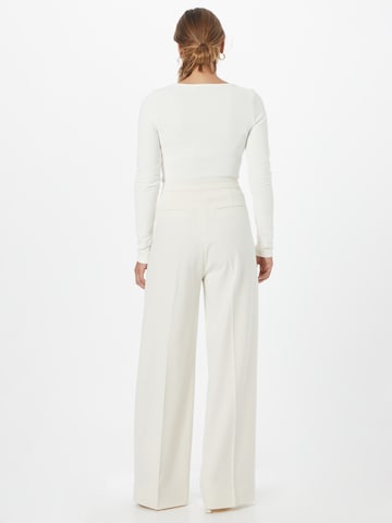 Wide leg Pantaloni con piega frontale di Copenhagen Muse in bianco