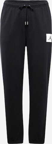Jordan Zwężany krój Spodnie 'ESS' w kolorze czarny: przód