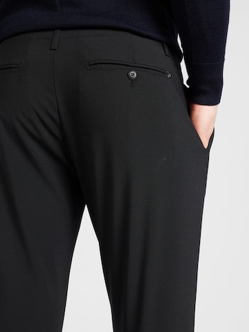 Tapered Pantaloni con pieghe 'BEN' di Dondup in nero