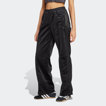 ADIDAS ORIGINALS Flared Pants in Black: front