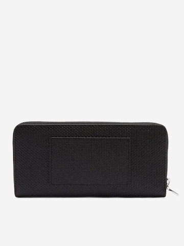 LACOSTE - Cartera 'Lacoste Compagnon cuir piqué unisexe Chantaco' en negro