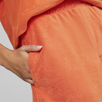 PUMA Loose fit Workout Pants in Orange