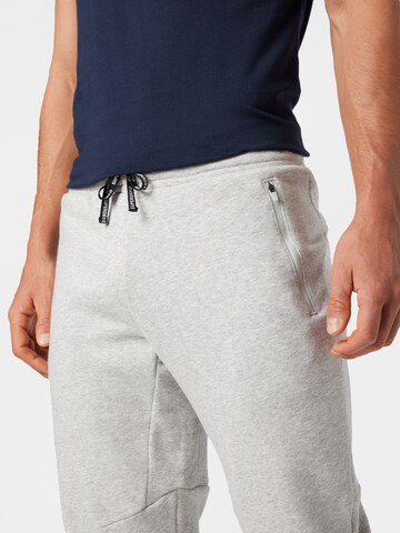 Tapered Pantaloni sport de la Superdry pe gri