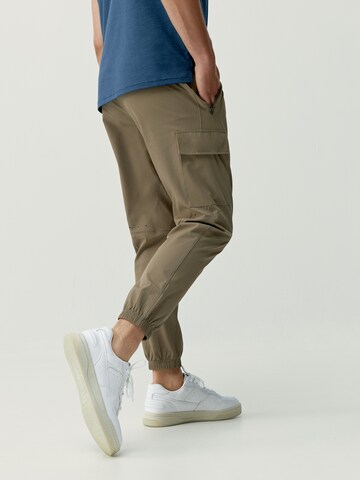 Born Living Yoga Tapered Weatherproof pants 'Minho' in Brown