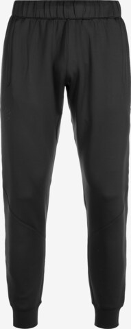 Effilé Pantalon de sport UNDER ARMOUR en noir