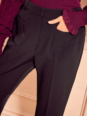 Wide leg Pantaloni con pieghe di love & roses in nero