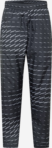 Tapered Pantaloni de la ADIDAS ORIGINALS pe negru: față