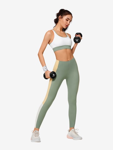 Yvette Sports Skinny Sportbyxa 'Carly' i grön