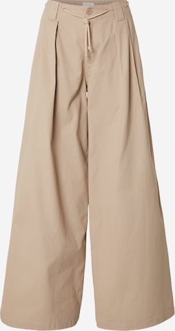 Kamila Šikl Loosefit Παντελόνι πλισέ σε μπεζ: μπροστά