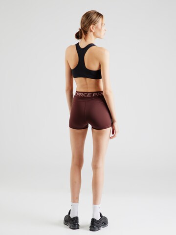 Skinny Pantalon de sport NIKE en violet