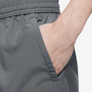 NIKE Regular Sports trousers in Grey