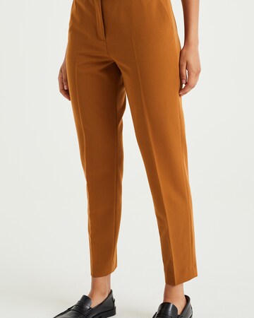 WE Fashion Slim fit Trousers with creases in Brown