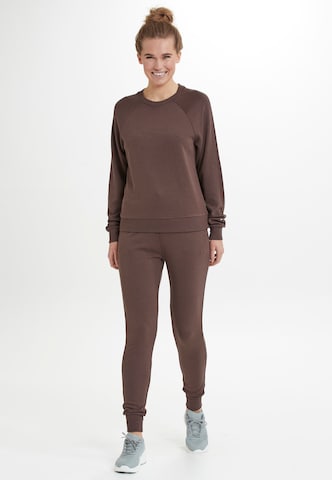 Athlecia Loose fit Workout Pants 'NIARY' in Brown