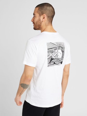 T-Shirt 'REDBOX CELEBRATION' THE NORTH FACE en blanc : devant