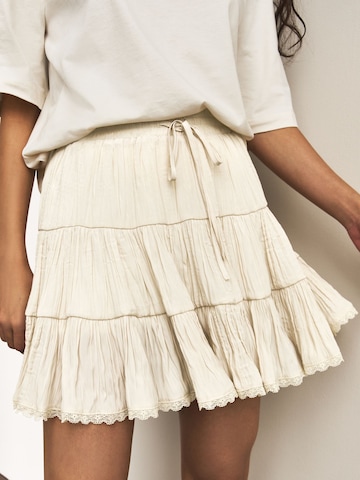 smėlio Next Sijonas: priekis