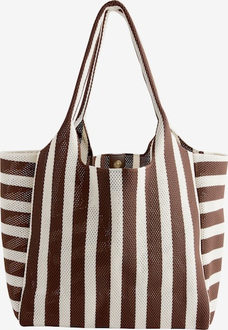 Next Shopper in Bruin: voorkant