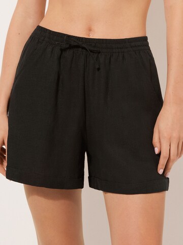 CALZEDONIA Regular Pants in Black: front