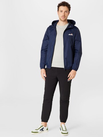 ELLESSE Tapered Urheiluhousut 'Ezio' värissä musta