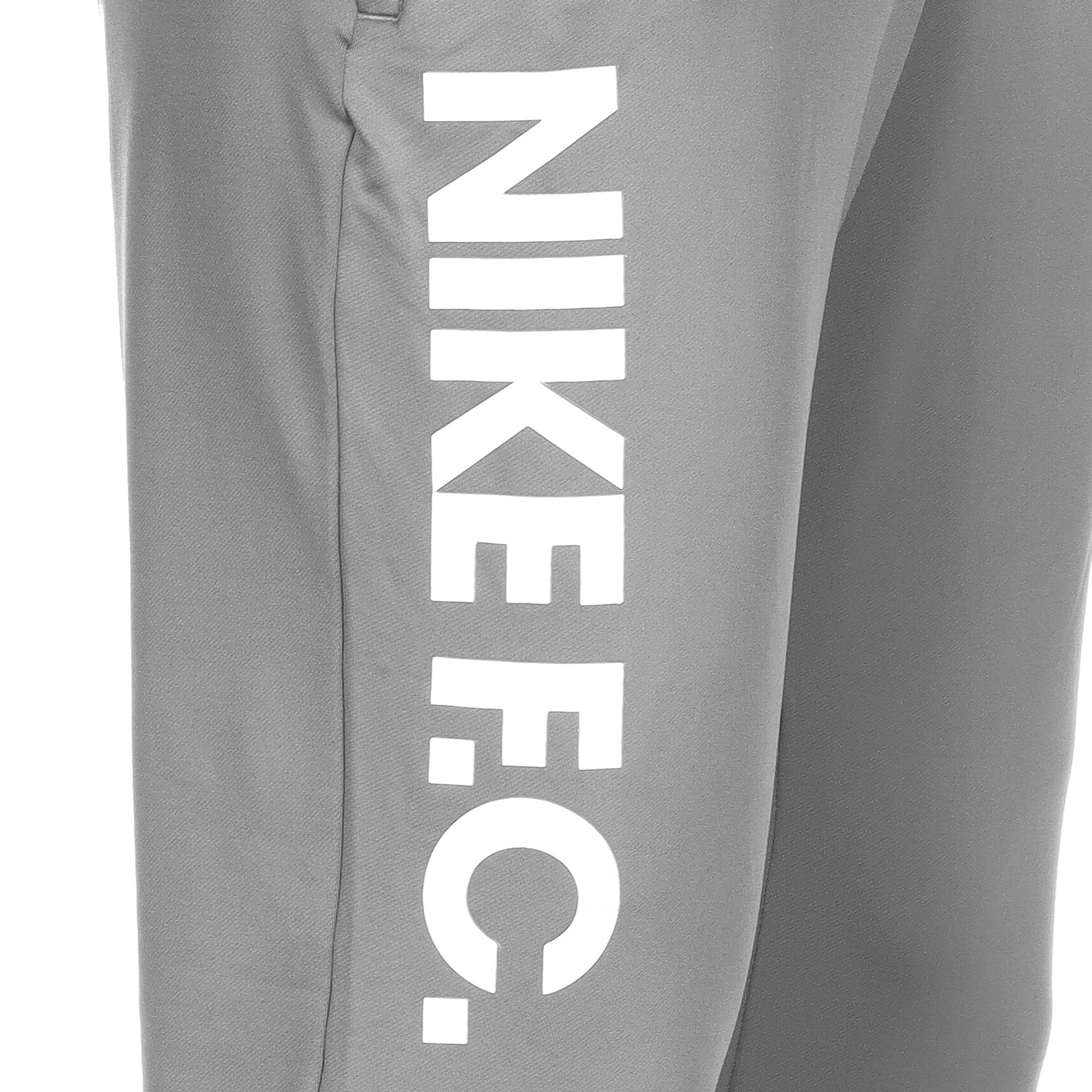 NIKE Slim fit Workout Pants in Grey