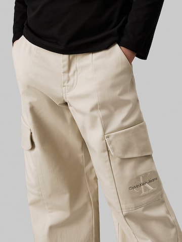 Calvin Klein Jeans Wide leg Trousers 'Cargo' in Beige