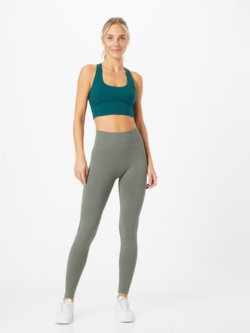 Athlecia Skinny Workout Pants 'Balance' in Green: front