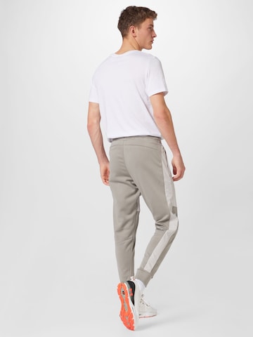 UNDER ARMOUR Tapered Sportsbukser 'Storm' i beige