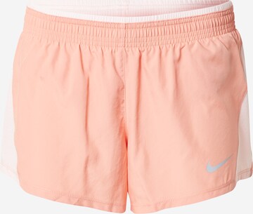 Regular Pantalon de sport NIKE en orange : devant