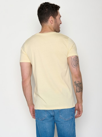GREENBOMB T-Shirt 'Canoe Fjord Guide' in Gelb
