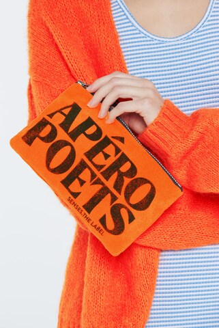 SENSES.THE LABEL Toiletry Bag in Orange: front