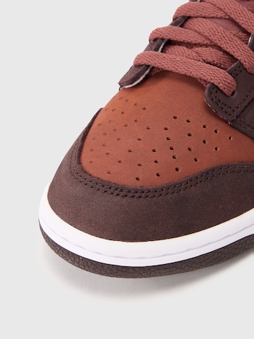 Baskets 'DUNK' Nike Sportswear en rouge