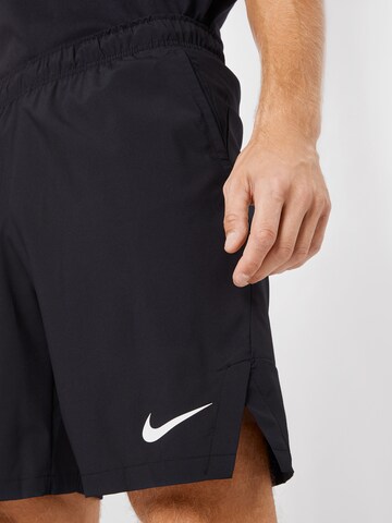 regular Pantaloni sportivi 'FLEX' di NIKE in nero