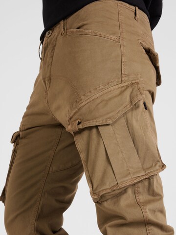 ALPHA INDUSTRIES Zúžený strih Kapsáče 'Spy' - Hnedá