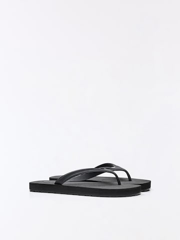 Bershka T-bar sandals in Black