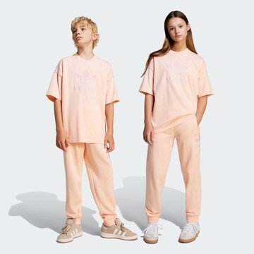 ADIDAS ORIGINALSTapered Hlače - roza boja: prednji dio