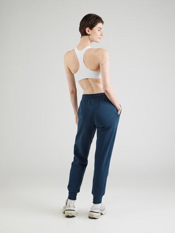 Nike Sportswear Zwężany krój Spodnie 'PHNX FLC' w kolorze niebieski