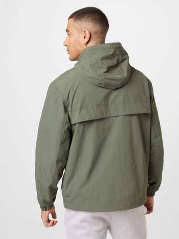 Tommy Jeans Between-Season Jacket 'Chicago' in Green