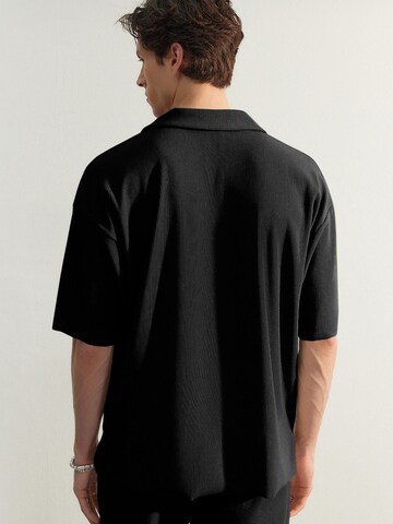 Trendyol Poloshirt in Schwarz