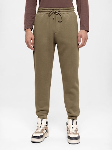 Antioch Tapered Trousers in Green: front
