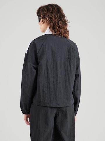 Reebok Prehodna jakna | črna barva