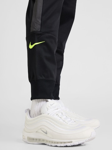 Nike SportswearTapered Hlače 'AIR' - crna boja