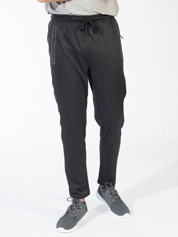 Slimfit Pantaloni sport de la Spyder pe negru: față