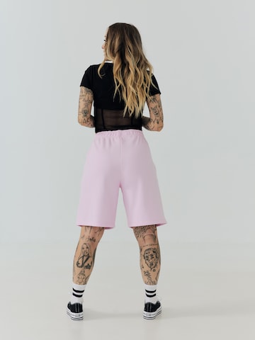 ABOUT YOU x Sharlota Regular Trousers 'Tessa' in Pink