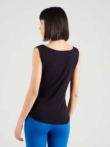 Sport top de la CURARE Yogawear pe negru